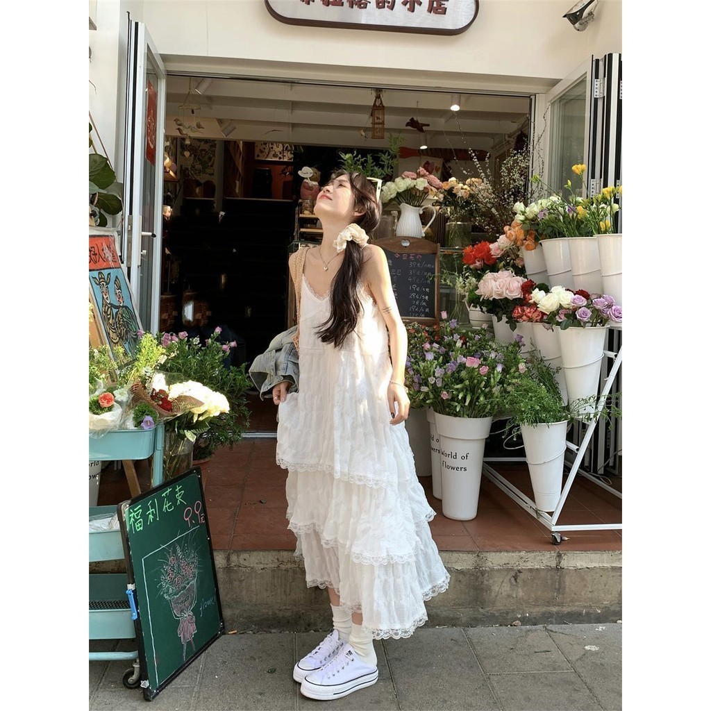 LYQYL คลังสินค ้ าพร ้ อมหวานลดอายุสีขาวชุดสลิงฝรั ่ งเศสผู ้ หญิงฤดูร ้ อนสไตล ์ วันหยุดขนาดเล ็ กหลวมเค ้ กกระโปรงยาว