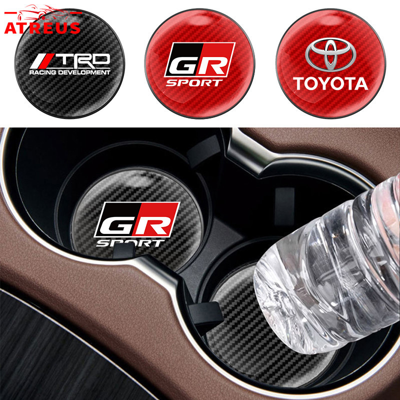 1ชิ้น Toyota GR แผ่นรองแก้วน้ําในรถยนต์ คาร์บอนไฟเบอร์แผ่นรองแก้วน้ําในรถยนต์ กันลื่น แผ่นรองแก้วเครื่องดื่ม สำหรับ Toyota Prius Fortuner Corolla Cross CHR Camry Wish Vios Veloz Estima Sienta Yaris Ativ Altis Hilux Revo bZ4X Hiace