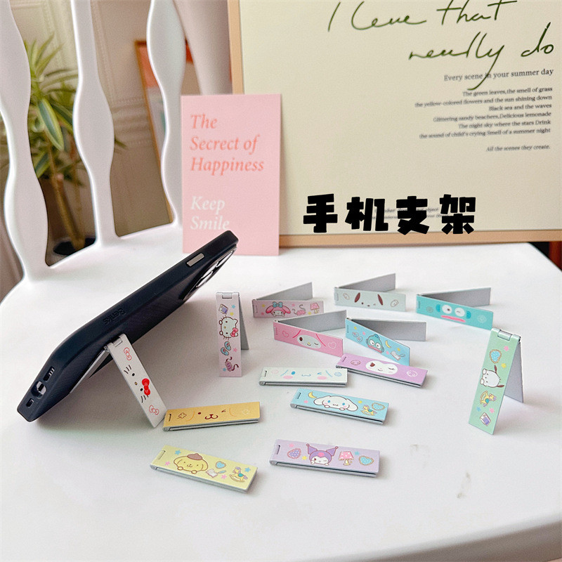 ขาตั้งโทรศัพท์มือถือญี่ปุ่นแบบพกพาที่มองไม่เห็นกรอบแบนขาตั้งโลหะพับได้การ์ตูนน่ารักเดสก์ท็อปสนับสนุน - รูปที่ 4