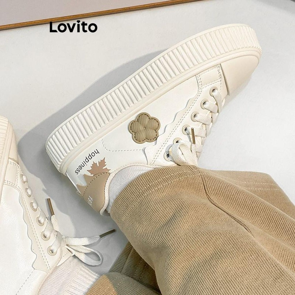Lovito รองเท้าผ้าใบผู้หญิง แต่งปะ ลายดอกไม้ สีพื้น สไตล์ลำลอง LFA41332