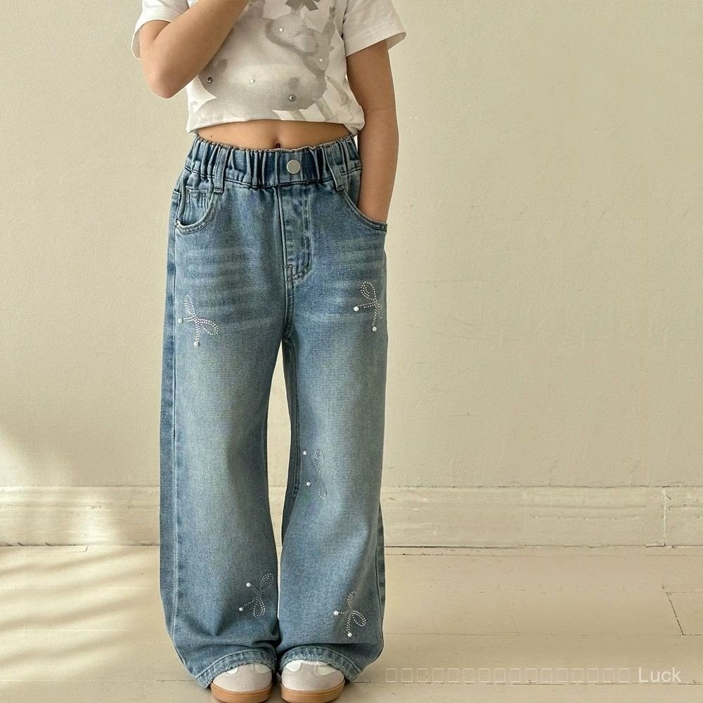 ยีนส์เด็กผู้หญิงฤดูใบไม้ผลิและฤดูใบไม้ร่วง 2025 ใหม่ ยีนส์ขาตรงหลวมกว้างมีโบว์ประดับเพชร