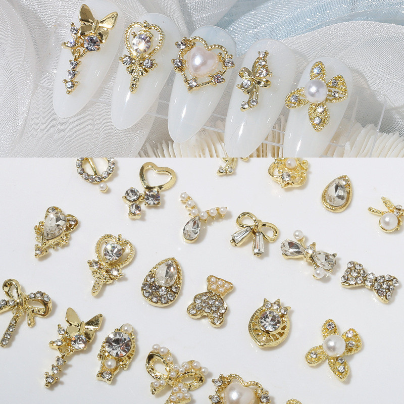 10pcs เล ็ บโลหะเครื ่ องประดับมุกใหม ่ รักโบว ์ เล ็ บเจาะหมีเพชรผสมตกแต ่ งขายส ่ ง