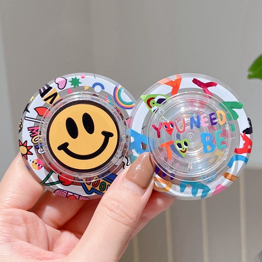 Magnetic Attraction ที่วางโทรศัพท์ทรงกลมตัวอักษรสีสันสดใสสีเหลืองหน้ายิ้มขาตั้งสําหรับโทรศัพท์มือถือ Naked Magsafe กรณีแท็บเล็ตโทรศัพท์มือถือ Kickstand Anti-drop PC Bracket