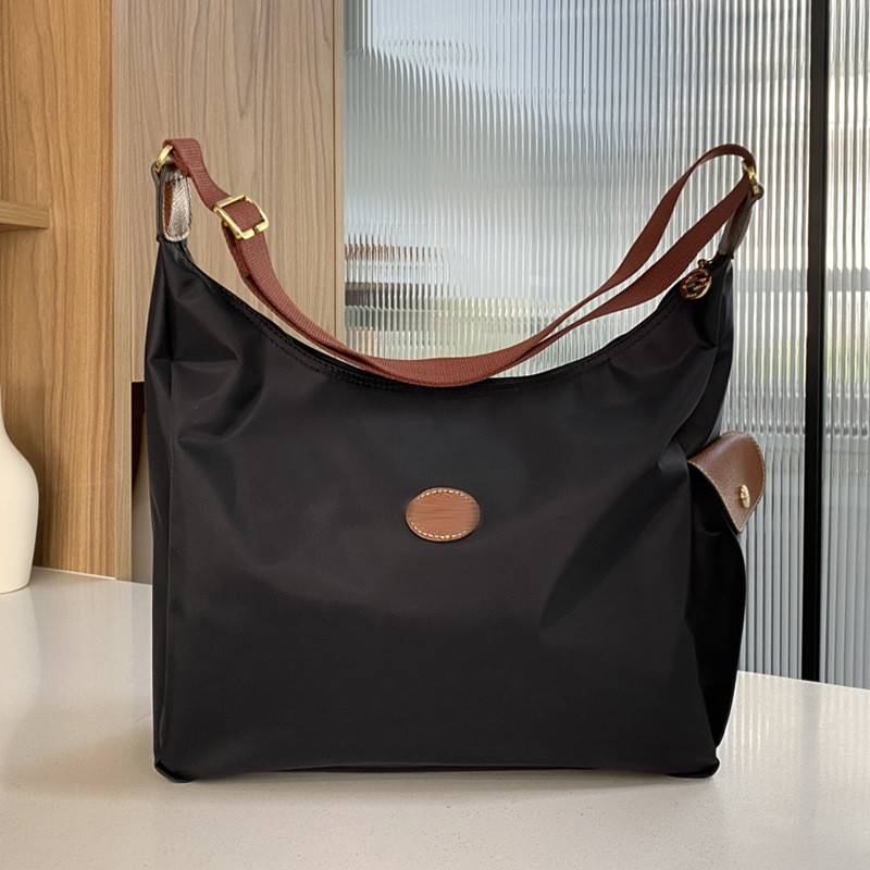 2025 สไตล์ใหม่ Commuter หญิงกระเป๋า hobo ไนลอน Crossbody กระเป๋าหญิง Retro Messenger กระเป๋าสะพายขนาดใหญ่ความจุกระเป๋าแม่เด็ก Dumpling กระเป๋า