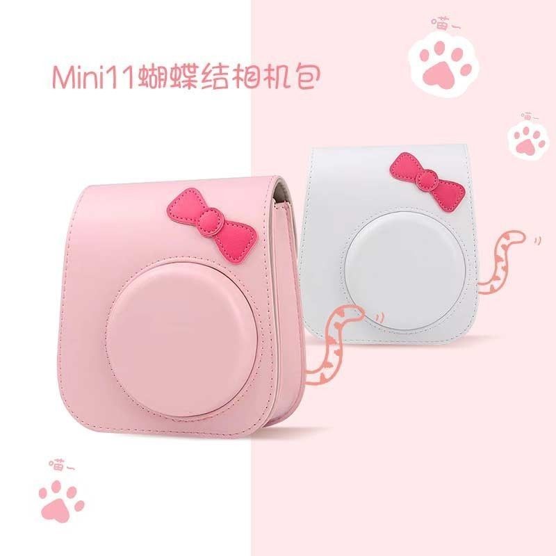 [1635 คอลเลกชันคน] Fuji Polaroid mini12 เคสป้องกัน mini11 กระเป๋ากล้องน่ารักการ์ตูน pu หนังโบว์กระเป๋าแนวทแยงแขวน~250309