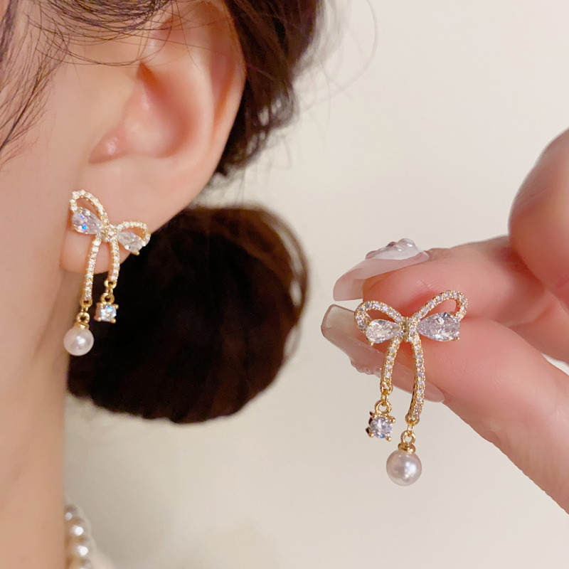 หรูหราแฟชั่นเพทายโบว์อารมณ์บุคลิกภาพระดับไฮเอนด์ต่างหูเข็มเงิน Who