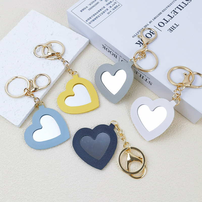 Creative กระจกพวงกุญแจน่ารัก Pu หนังรูปหัวใจแหวนแบบพกพาแต่งหน้ากระจก Charms ผู้หญิงกระเป๋าถือรถหูฟัง Pendnats