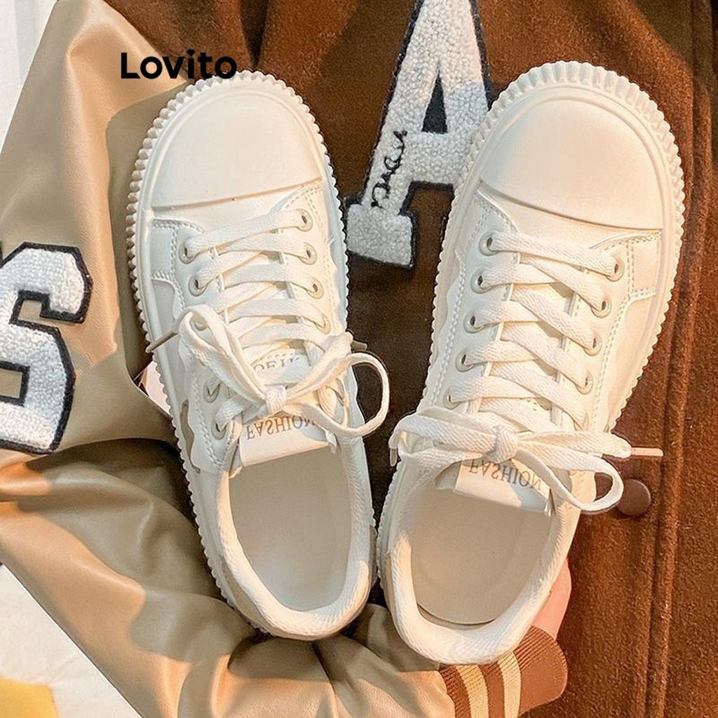 Lovito รองเท้าผ้าใบผู้หญิง แต่งปะ ลายดอกไม้ สีพื้น สไตล์ลำลอง LFA41332