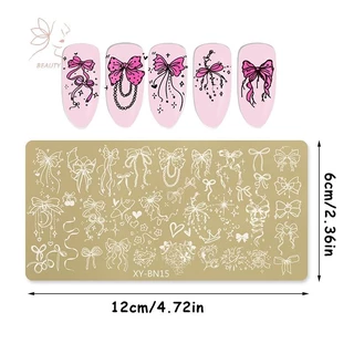 [maybeauty] แผ่นปั๊มเล็บสี่เหลี่ยมสีทอง 12x6 ซม.Bowknot ดอกไม้ดอกไม้ไฟออกแบบเล็บแม่แบบสําหรับตกแต่งเล็บ DIY {TH}