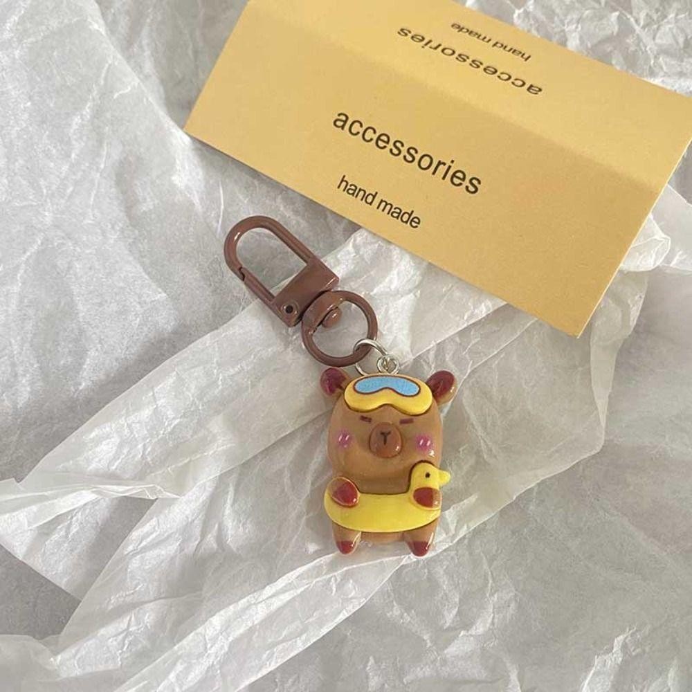 ROSEGOOD พวงกุญแจ Capybara, พวงกุญแจการ์ตูนสร้างสรรค์, ไม้แขวนเสื้อกระเป๋าเป้สะพายหลัง Kawaii Aqua Dolphin - รูปที่ 7