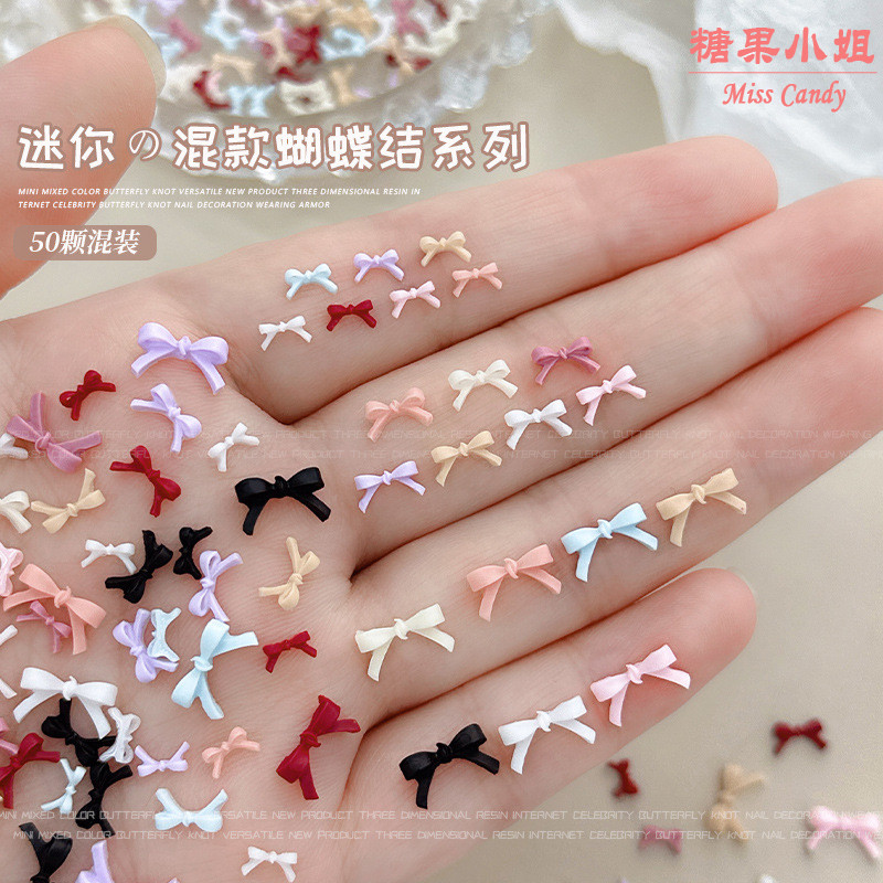 50ชิ้นผสมสีมินิโบว์อุปกรณ์แต่งเล็บ ผู้มีอิทธิพล ฝรั่งเศสผูกโบว์ขนาดเล็กขนาดที่มีสีสันสีผสมเรซิ่นเพชรสวมใส่อุปกรณ์เล็