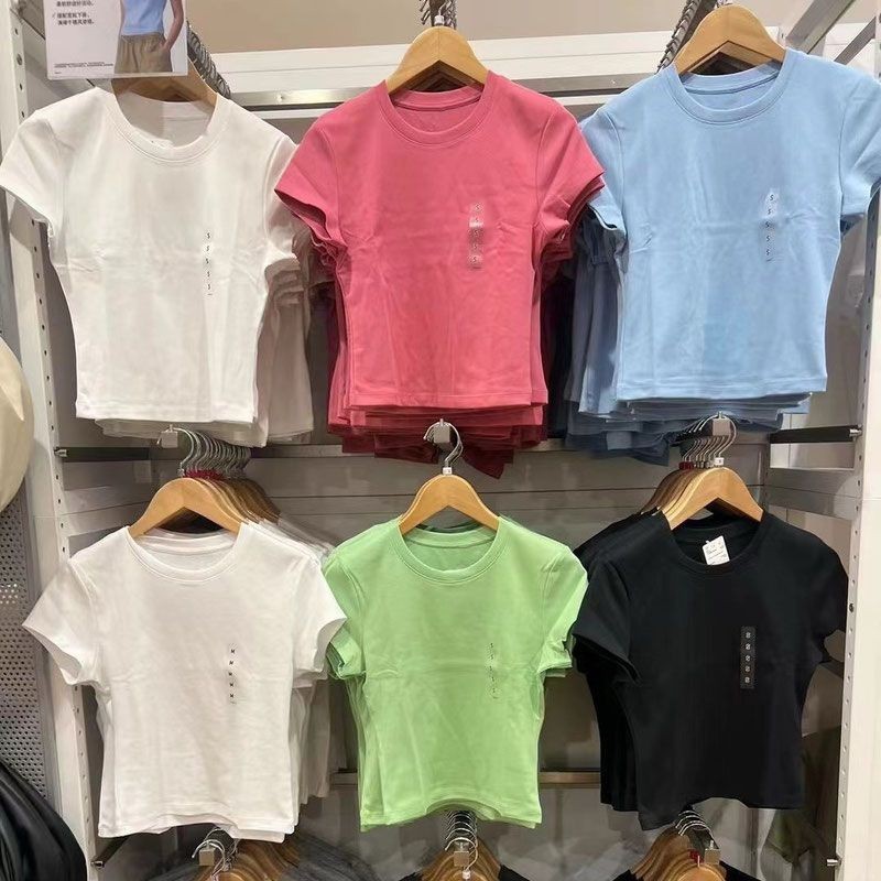 เสื้อผ้าผู้หญิง 2024 ฤดูร้อนสาวร้อน ที คอกลมสั้นเสื้อยืดเอวสูงแขนสั้นสลิมฟิต จุดต่ําสุด เสื้อยืด465760
