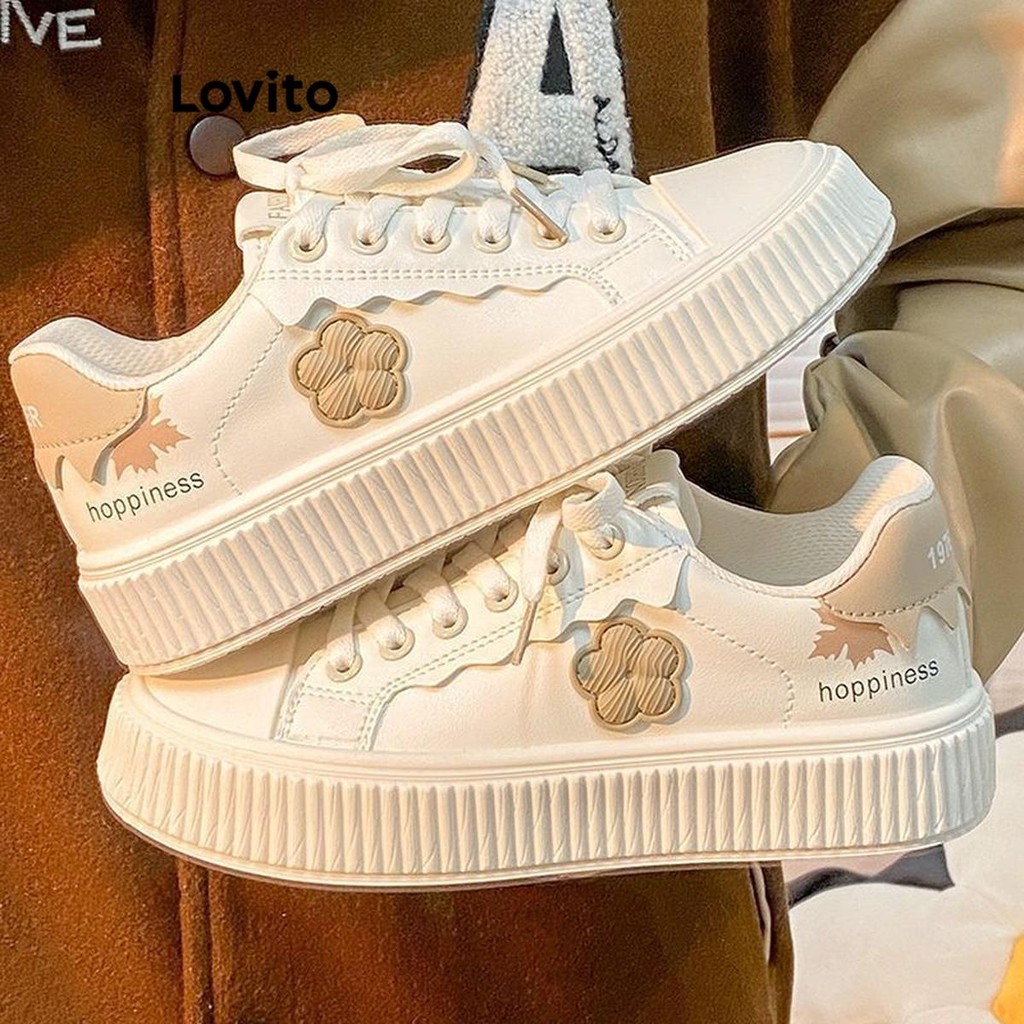 Lovito รองเท้าผ้าใบผู้หญิง แต่งปะ ลายดอกไม้ สีพื้น สไตล์ลำลอง LFA41332