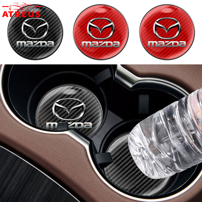 1ชิ้น Mazda แผ่นรองแก้วน้ําในรถยนต์ คาร์บอนไฟเบอร์แผ่นรองแก้วน้ําในรถยนต์ กันลื่น แผ่นรองแก้วเครื่องดื่ม สำหรับ Mazda 2 3 CX5 CX30 CX8 CX3 Mazda2 6 5 CX9 BT50