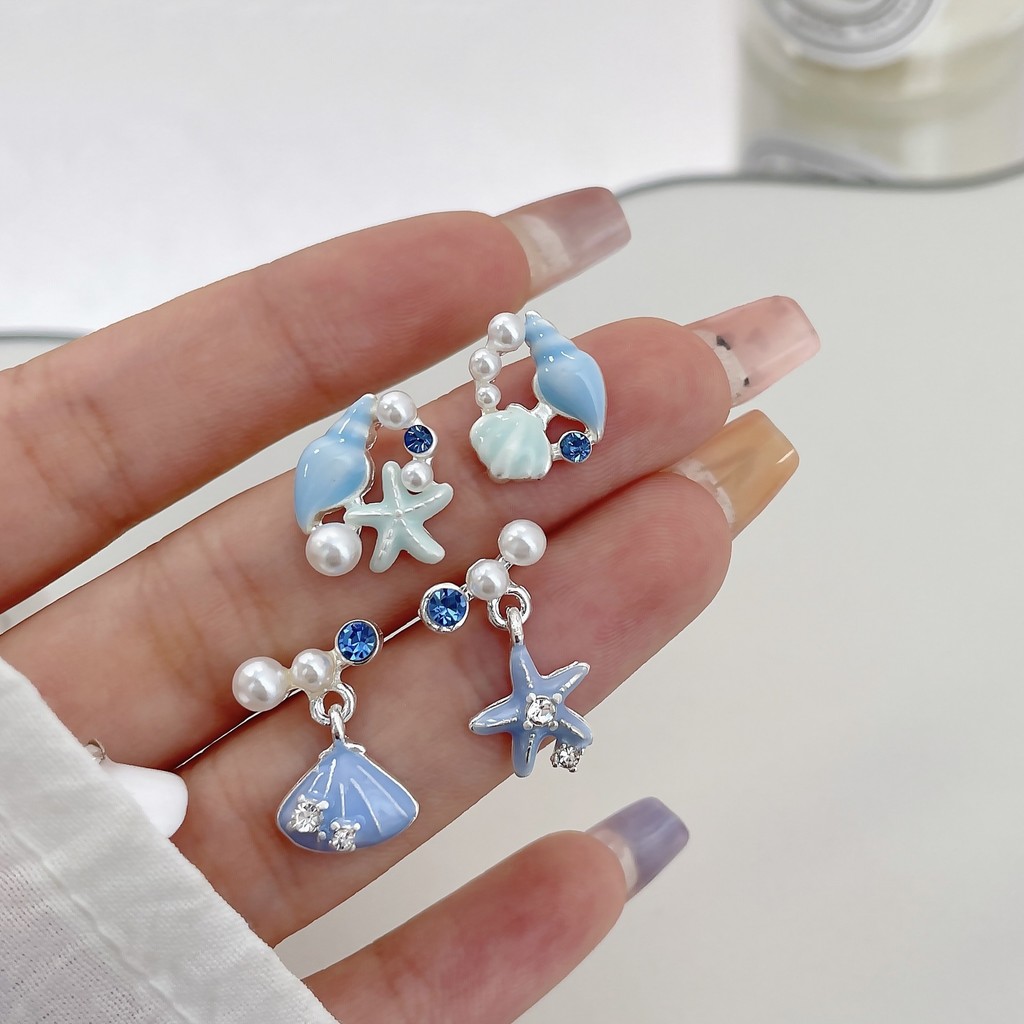 Blue Ocean Shell ต่างหูปลาดาวผู้หญิงเวอร์ชั่นเกาหลีสไตล์วันหยุดฤดูร้อนต่างหูเข็มเงินสไตล์ใหม่ Niche Design ต่างหูประณีต