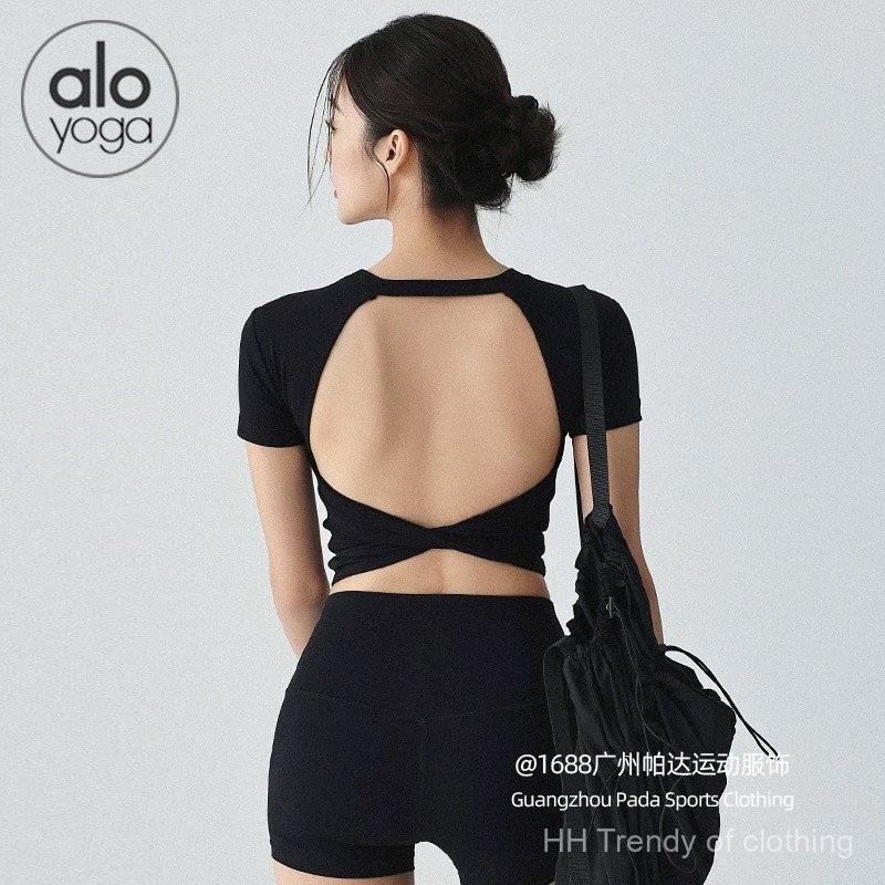 alo ชุดโยคะผู้หญิงแขนสั้นมีแผ่นรองหน้าอกเสื้อออกกำลังกายหลังสวยเซ็กซี่สไตล์ยุโรปและอเมริกาเสื้อยืดกีฬาใส่ด้านนอกเก็บเอวใส่แล้วดูผอมเพรียว