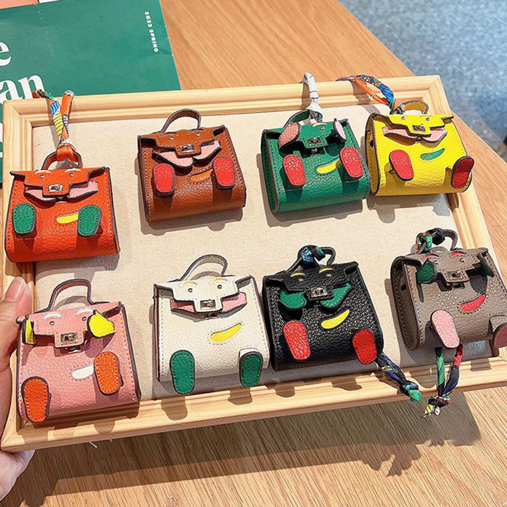 Creative Mini หูฟังบลูทูธกระเป๋าเก็บพวงกุญแจแขวนจี้กระเป๋า Organizer