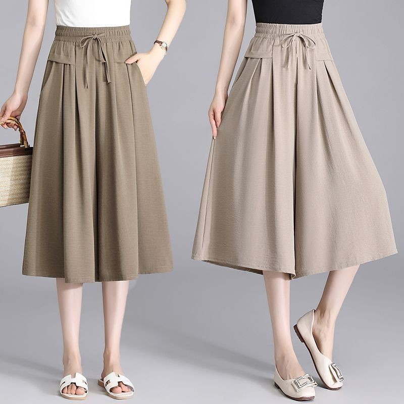 กางเกงขาสั้นขากว้างผ้าไหมน้ําแข็งที่ทันสมัยและลําลองใหม่ของผู้หญิงที่มีสไตล์ที่เรียบง่ายและหลวมกางเกงขาสั้นเอวสูงอเนกประ