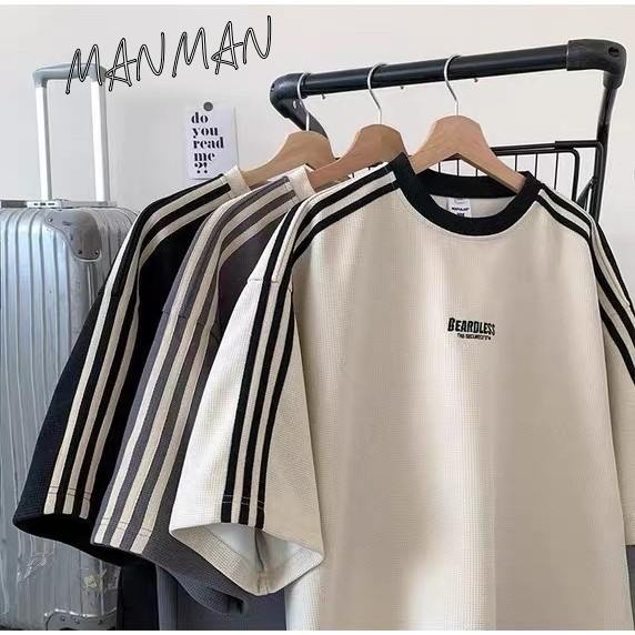 MANMAN เสื้อยืดผู้ชาย ผ้าวาฟเฟิลด์ สไตล์ลายทาง ลาเกรน แขนสั้นแบบหลวมลำลอง เสื้อฤดูร้อน