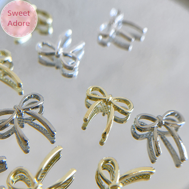 Sweetadore 10pcs Bow Deco Nail Art Charm 3D เงิน/ทอง Bowknot ริบบิ้นตกแต่งเล็บอะไหล่ DIY อุปกรณ์แต่งเล็บ TH