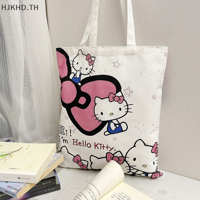 SANRIO [ดีกว่า] การ์ตูน สวัสดี คิตตี้ ผ้าใบกระเป๋า น่ารัก ซานริโอ กระเป๋าถือแบบพกพาความจุขนาดใหญ่ผู้หญิงกระเป๋าช้อปปิ้งกระเป๋าเก็บ [สวย]
