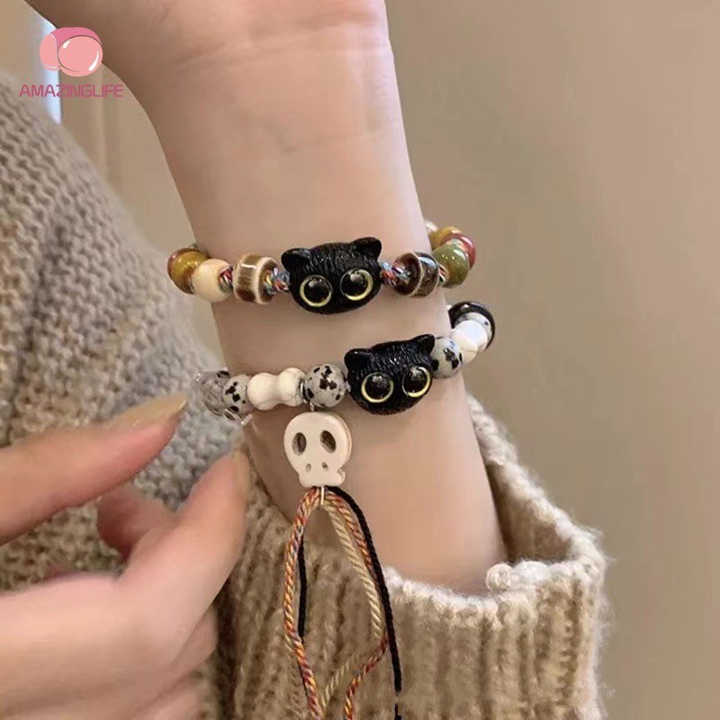 1 พีซี สร้อยข้อมือหัวแมวโครงกระดูกสีดําหวาน - ลูกปัดแมวการ์ตูนน่ารักสร้อยข้อมือโครงกระดูกสีขาว - เครื่องประดับกําไลข้อมือเชือกถักอินเทรนด์