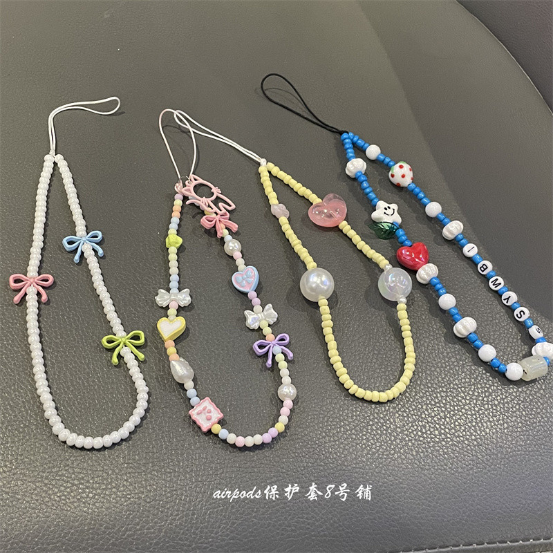 Huiwanju เกาหลี ins niche สีรักโบว์โทรศัพท์มือถือเชือกเส้นเล็กกระเป๋าจี้หูฟังกรณีจี้กุญแจรถ