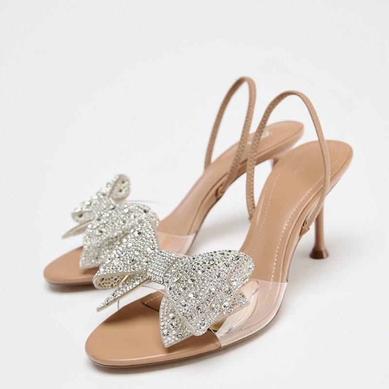 [คลังสินค้าพร้อม] 2025 รองเท้าผู้หญิงใหม่ ลมเพชรโบว์รองเท้าแตะส้นสูงสายรัดด้านหลังโปร่งใส
