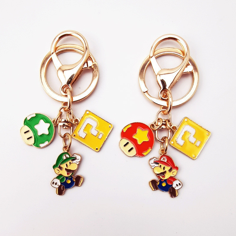 Super Mary พวงกุญแจจี ้ Mario คู ่ โรงเรียนกระเป ๋ าแขวนเครื ่ องประดับการ ์ ตูน Airpods ชุดป ้ องกันของขวัญ