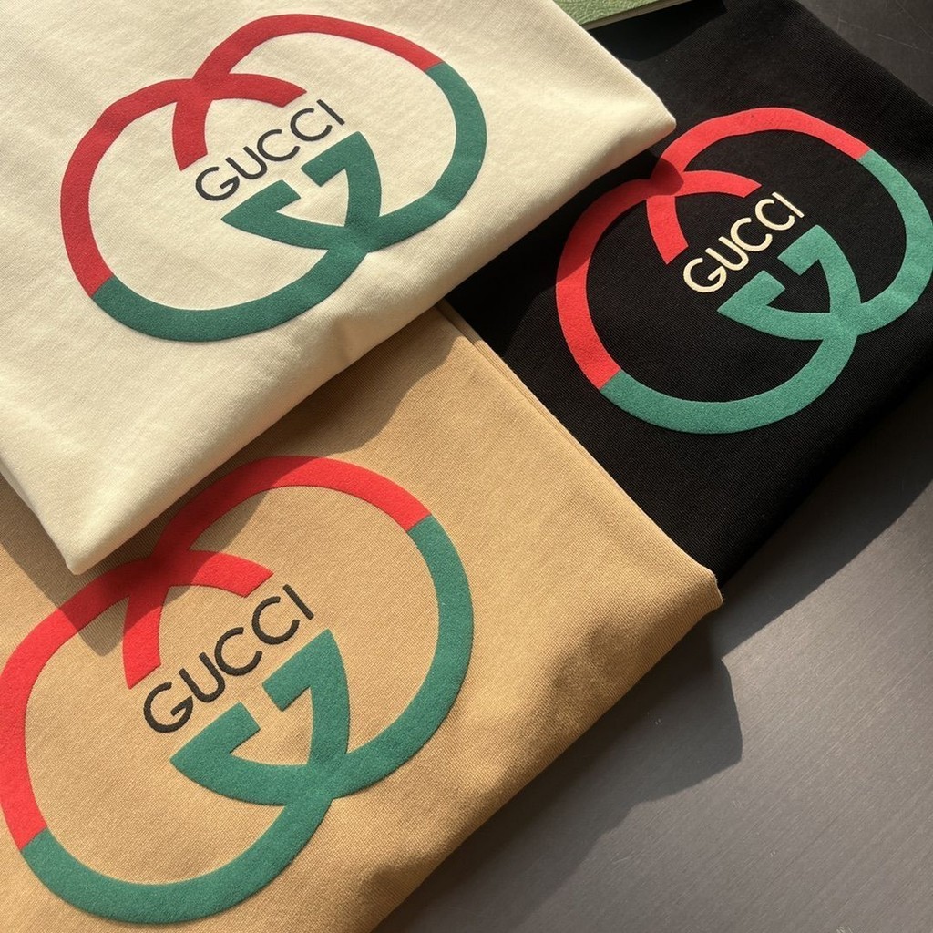 พร้อมส่ง เสื้อยืดแขนสั้นลําลอง คอกลม ผ้าฝ้าย พิมพ์ลายโลโก้ TOP GU ทรงหลวม ขนาดใหญ่ คุณภาพสูง แฟชั่นฤดูร้อน สําหรับผู้ชาย และผู้หญิง ไซซ์ XS - 3XL
