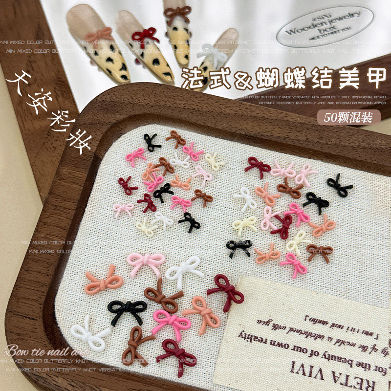 ใหม่สีดําสีขาวสีชมพูโบว์ผูกผสมสีโบว์อุปกรณ์แต่งเล็บเรซิ่นเพชรสวมใส่เล็บอุปกรณ์เสริม