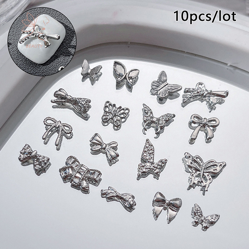 [maybeauty] 10 ชิ้นสีเงินตกแต่งเล็บคริสตัลเพทายโบว์ตกแต่งเล็บ 3D โลหะอุปกรณ์แต่งเล็บ {TH}