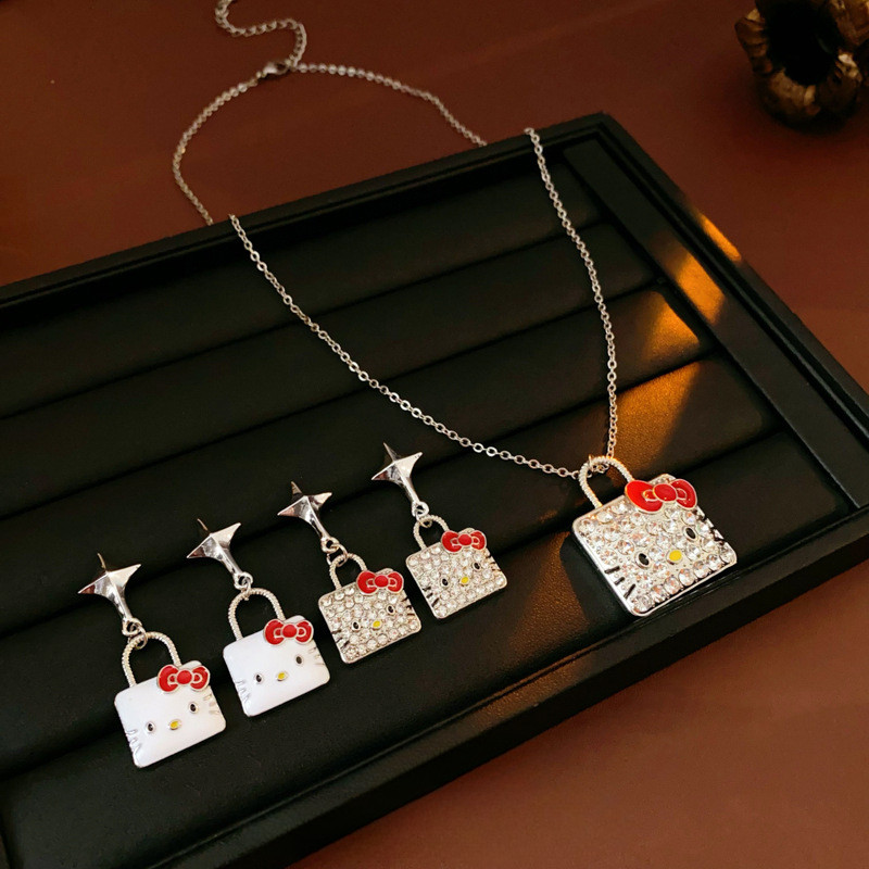 เข็มเงินหยดน้ํามันผีเสื้อปมลูกแมวหูเล็บขนาดเล็กบุคลิกภาพแฟชั่นเสื้อกันหนาวโซ่อเนกประสงค์ระดับไฮเอนด์ชุดเครื่องประดับสําหรับผู้หญิง