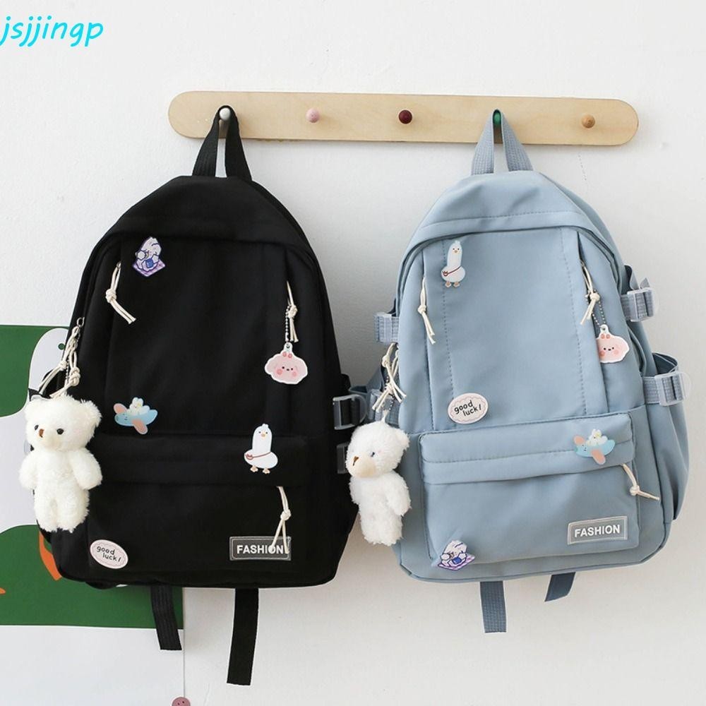 Jsjjingpกระเป๋าเป้สะพายหลังสีทึบ,หมีจี้ตรานักเรียนกระเป๋านักเรียน,สร้างสรรค์ความจุขนาดใหญ่สไตล์เกาหลีกระเป๋าเดินทางกระเป๋าสะพายนักเร