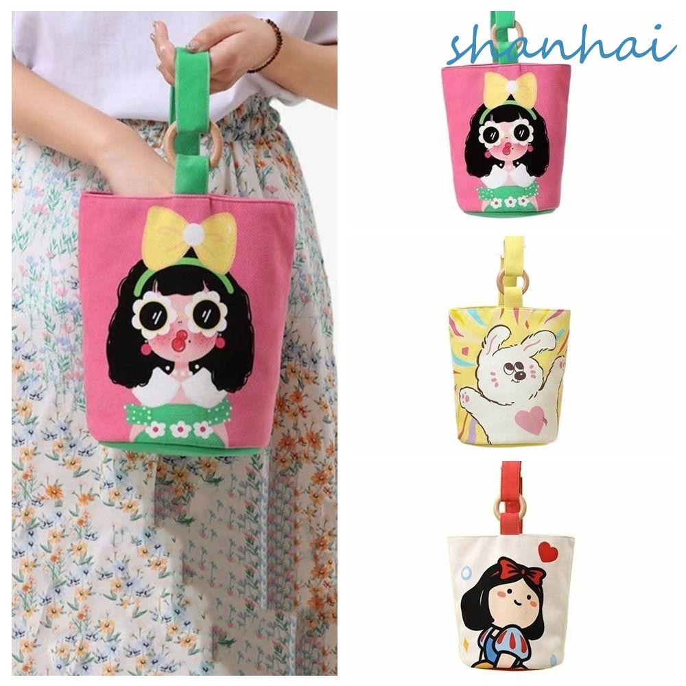 Shanhai กระเป๋าผ้าแคนวาส ทรงบักเก็ต ใส่กล่องอาหารกลางวัน ลายการ์ตูน ความจุขนาดใหญ่ แบบพกพา สําหรับเด็กผู้หญิง
