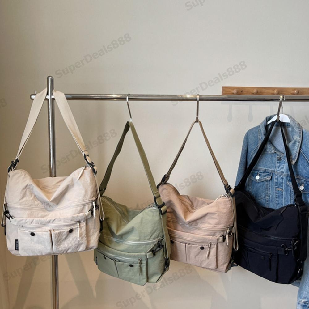 กระเป๋าสะพายลําลองหญิงความจุขนาดใหญ่กระเป๋าเป้สะพายหลังอเนกประสงค์สีทึบกระเป๋าเรียบง่ายกระเป๋าพักผ่อ