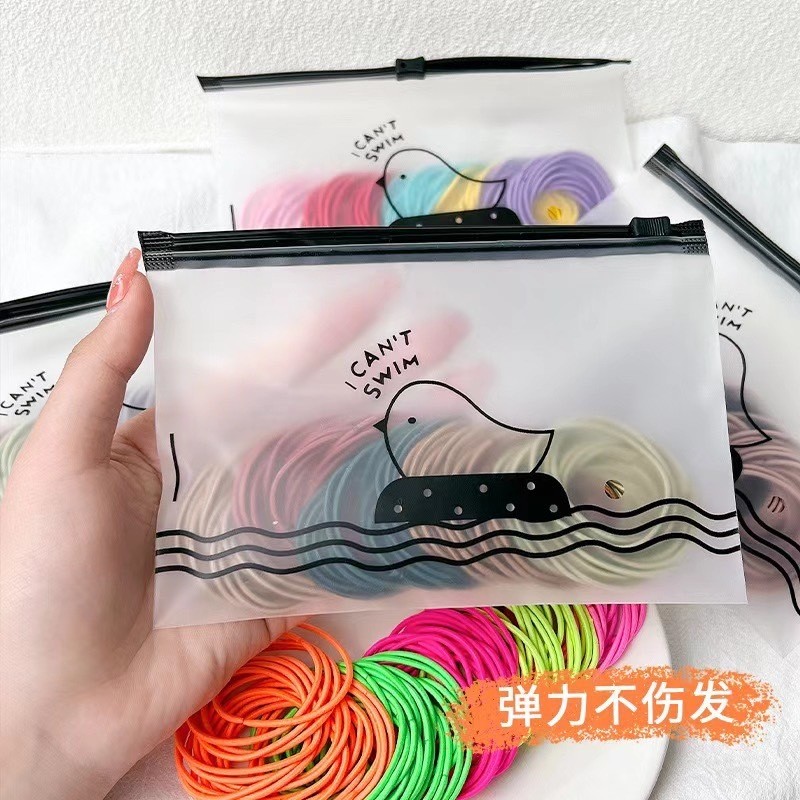 ยางรัดผมสีพื้น หลากสี สไตล์เกาหลี แพ็ค100เส้น พร้อมซองใส่ [จัดส่งจากประเทศไทย