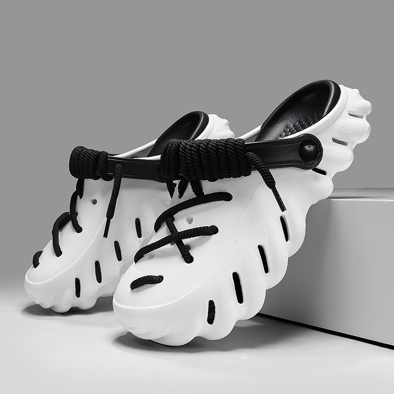 2024 รองเท้าแตะชายฤดูร้อนสวมใส่ลื่นรองเท้าแตะชายหาดแนวโน้มรองเท้าแตะลําลองระบายอากาศด้านล่างหนาคุณภาพสูง