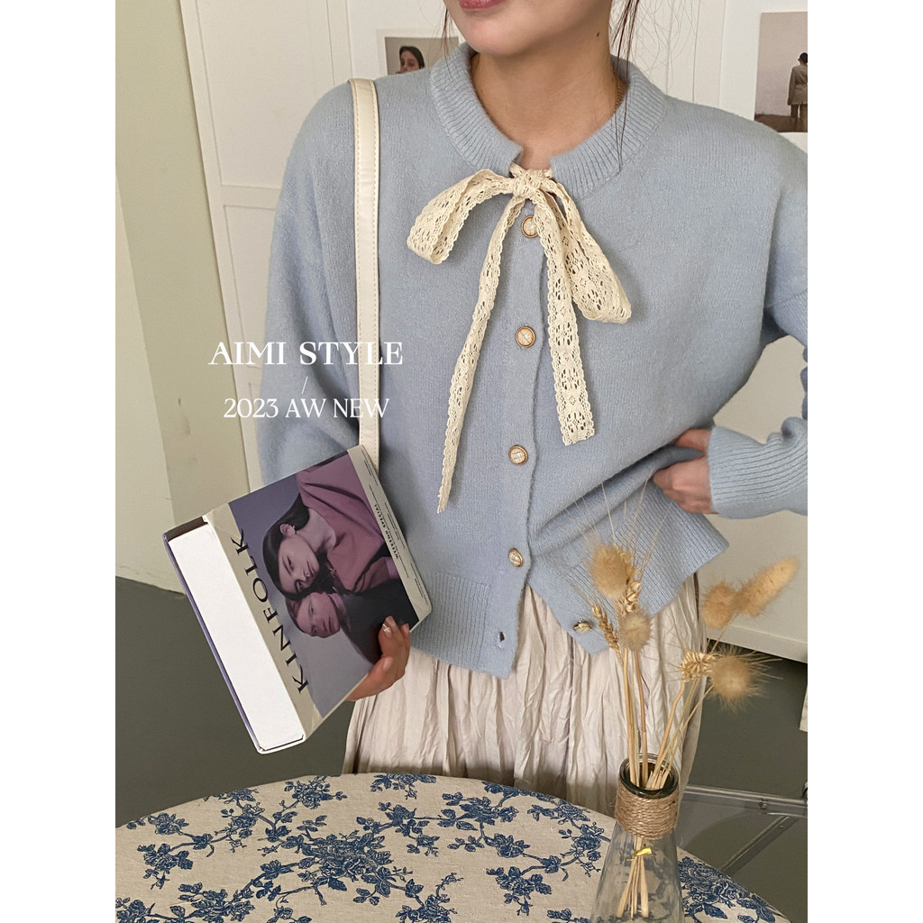 ฤดูใบไม้ร่วงใหม่ผู้หญิงเกาหลีรุ่นผีเสื้อโบว์ลูกไม้สายรัดอเนกประสงค์แขนยาวถักเสื้อสเวตเตอร์ถัก 240819