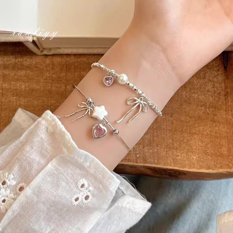 ส่งเร็ว สร้อยข้อมือโบว์หัวใจสีชมพูหวานสไตล์เกาหลีปรับได้เปิดระดับไฮเอนด์เครื่องประดับผู้หญิง-Ranliyy