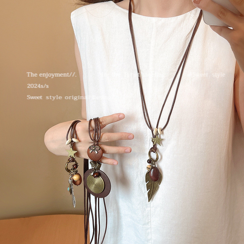 ใหม่สไตล์จีน Zen สร้อยคอขนนกยาวหญิงสไตล์ชาติพันธุ์ Retro All-Match ซ้อนเสื้อกันหนาว Niche อุปกรณ์เสร