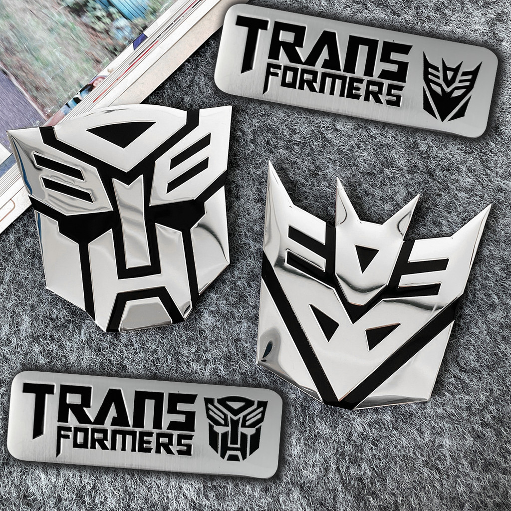 Transformers สติ๊กเกอร์ติดรถยนต์ Autobot สัญลักษณ์อลูมิเนียมป้ายโลหะรูปลอกสําหรับรถจักรยานยนต์สกู๊ตเตอร์หางรถ Trunk Body