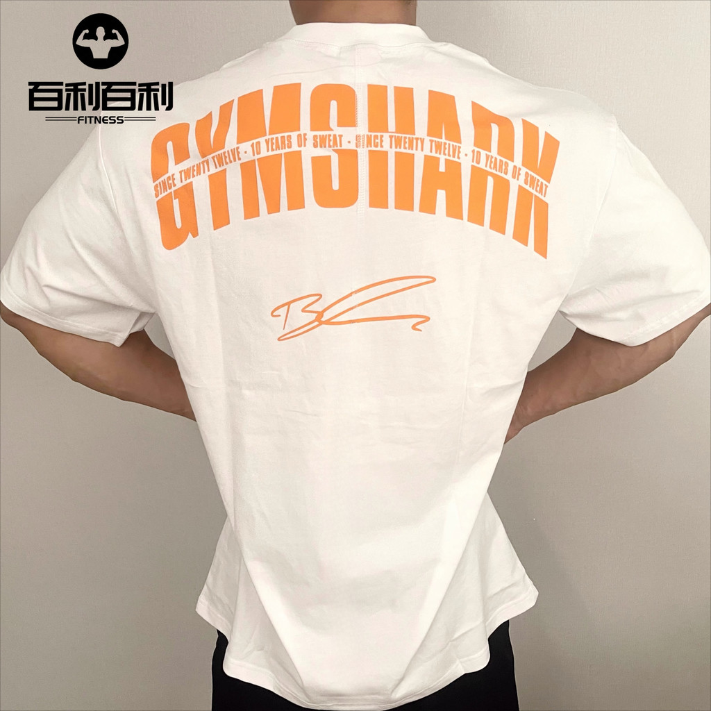 GYMSHARK GS10 STRONG เสื้อยืดแขนสั้นสำหรับผู้ชายและผู้หญิ​ง ทำจากผ้าฝ้ายแท้ สบายและหลวมรอบคอดี