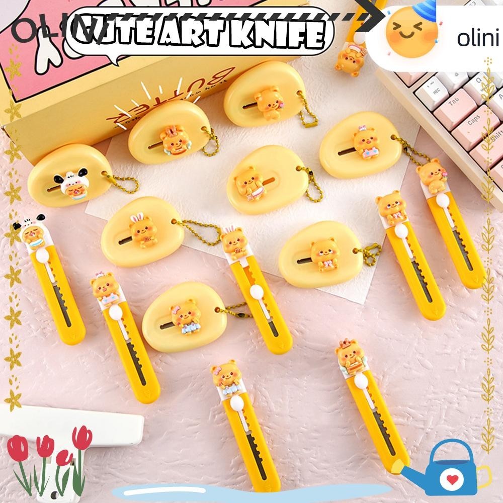 เครื่องตัดหมีเนย OLIINI, เครื่องมือตัดกระดาษพลาสติกการ์ตูน, อุปกรณ์สํานักงานของโรงเรียน ที่เปิดตัวอักษรแบบหดได้เรซิน