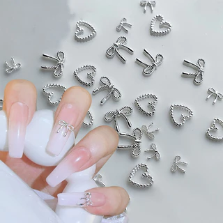 10pcs โลหะผสม Bowknot Love เล็บ Art Charms ตกแต่ง 3D โลหะหรูหรา Silver Bows รูป Jewellery DIY เล็บออกแบบอุปกรณ์