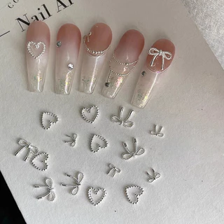 10pcs โลหะผสม Bowknot Love เล็บ Art Charms ตกแต่ง 3D โลหะหรูหรา Silver Bows รูป Jewellery DIY เล็บออกแบบอุปกรณ์