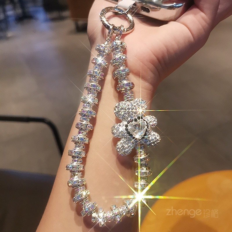 [พีดีเอ็ม] พลอยเทียม ระดับไฮเอนด์แขวนโซ่แฟชั่นเทพธิดาโทรศัพท์มือถือเชือกเส้นเล็กสไตล์สั้นข้อมือกระพริบจี้เพชรพร้อมเปลือกคลิปแข็งแรงกลางแจ้งป้องกันการสูญ