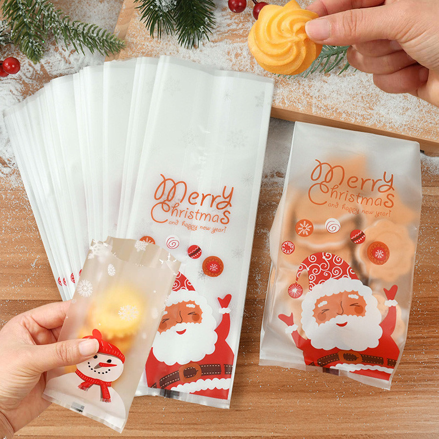 10-50ชิ้นถุงกระดาษแก้วคริสต์มาสถุงขนมมนุษย์หิมะถุงของขวัญคริสต์มาสใสถุงขนมพลาสติกคริสต์มาสเหมาะสําหรับวันหยุดฤดูหนาวอุปกรณ์งานเลี้ยงคริสต์ม