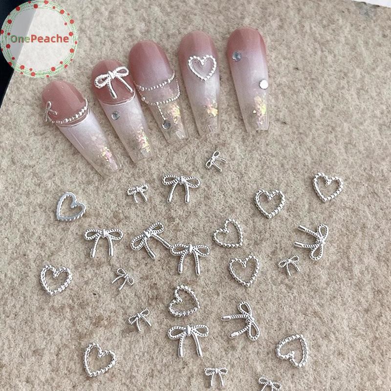 OnePeache 10pcs โลหะผสม Bowknot Love เล็บ Art Charms ตกแต่ง 3D โลหะหรูหรา Silver Bows รูป Jewellery DIY เล็บออกแบบอุปกรณ์ TH