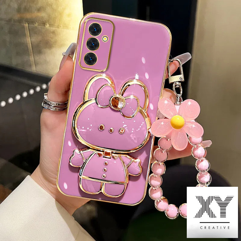 เคส Samsung A16 A54 5G A55 5G A15 5G A34 A25 A24 A14 เคสโทรศัพท์ชุบด้วยไฟฟ้าหรูหรา 3D กระต่ายเครื่องสําอางกระจกแต่งหน้าขาตั้งเคส TPU แบบนุ่มพร้อมสร้อยข้อมือเชือกเส้นเล็ก เคสโทรศัพท์ Samsung A16 A54 5G A55 5G A15 5G A34 A25 A24 A14